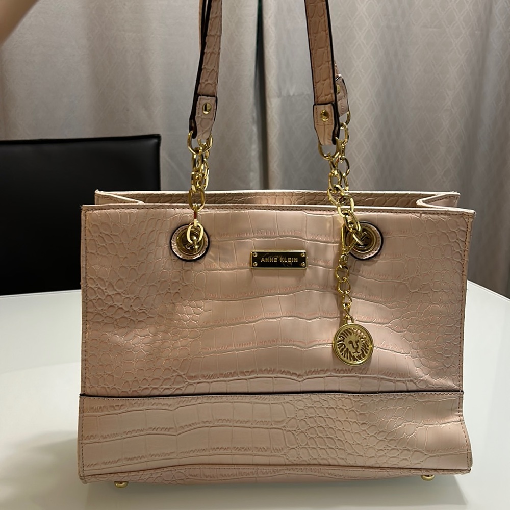 Blush pink Anne Klein handbag with gold detail straps